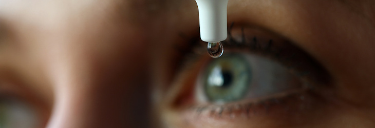 image of an eye drop being placed in an eye